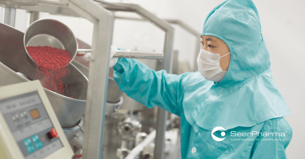 Asian pharmaceutical GMP operator manufacturing tablets