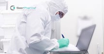 Scientist recording data for personalised medicine