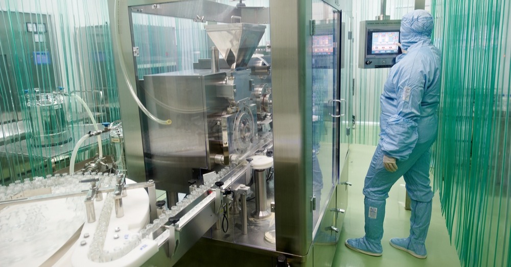 Operator-working-in-a-sterile-good-aseptic-practices-GMP-cleanroom