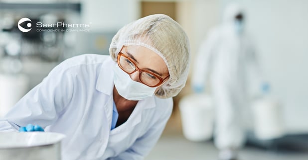 GMP Internal Auditor from QA examining manufacturing equipment