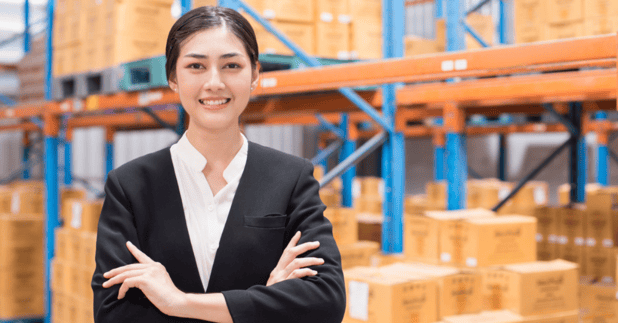 Happy Asian Woman in Warehouse