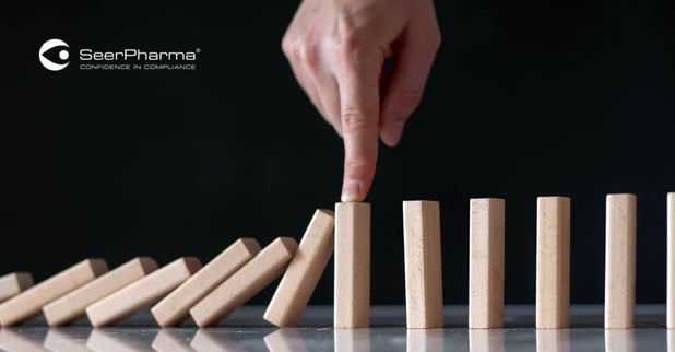 hand-blocking-falling-dominoes-as-risk-management